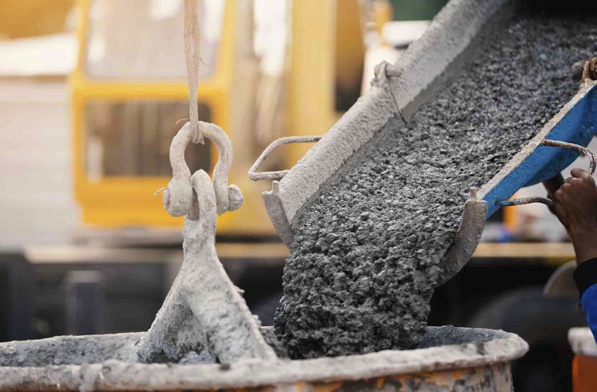 Fresh concrete being poured for garage floor in Wake Forest, NC